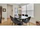 Bright dining area with oval table and six chairs at 104 Johnston Farm Ln, Woodstock, GA 30188