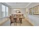 Bright dining room featuring hardwood floors and a large table at 104 Johnston Farm Ln, Woodstock, GA 30188