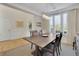Formal dining room with hardwood floors, wainscoting, and large windows at 104 Johnston Farm Ln, Woodstock, GA 30188