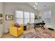 Home office with yellow chair and colorful rug at 104 Johnston Farm Ln, Woodstock, GA 30188