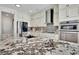 Granite countertop kitchen with stainless steel appliances at 104 Johnston Farm Ln, Woodstock, GA 30188