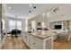 Open concept kitchen with large island and granite countertops at 104 Johnston Farm Ln, Woodstock, GA 30188