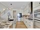 Modern kitchen with stainless steel appliances and granite countertops at 104 Johnston Farm Ln, Woodstock, GA 30188