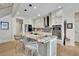 Modern kitchen with stainless steel appliances and granite island at 104 Johnston Farm Ln, Woodstock, GA 30188