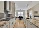 Open concept kitchen with island and breakfast nook at 104 Johnston Farm Ln, Woodstock, GA 30188