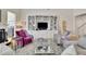 Two-story living room with built-in shelving and hardwood floors at 104 Johnston Farm Ln, Woodstock, GA 30188