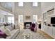 Bright living room with high ceilings, fireplace, and built-ins at 104 Johnston Farm Ln, Woodstock, GA 30188