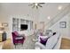Open living room with high ceilings and a view of the kitchen at 104 Johnston Farm Ln, Woodstock, GA 30188