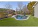 Inviting kidney-shaped pool with surrounding landscaping at 104 Johnston Farm Ln, Woodstock, GA 30188