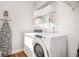 Laundry room with washer, dryer, and shelving at 2426 Woodbridge Dr, Marietta, GA 30066