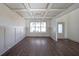 Formal dining room with coffered ceilings and hardwood floors at 5430 Crow Dr, Cumming, GA 30041