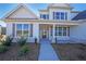 Inviting front entrance with a charming porch and walkway at 5430 Crow Dr, Cumming, GA 30041