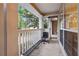 Private balcony with white railing and view of trees at 5641 Roswell Rd # 103, Atlanta, GA 30342