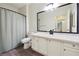 Clean bathroom with a vanity and shower/tub combo at 5641 Roswell Rd # 103, Atlanta, GA 30342