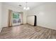 Spacious bedroom with wood-look flooring and large window at 5641 Roswell Rd # 103, Atlanta, GA 30342