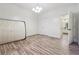 Bright bedroom with wood-look floors and access to bathroom at 5641 Roswell Rd # 103, Atlanta, GA 30342