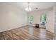 Bright dining room with wood-look floors and large windows at 5641 Roswell Rd # 103, Atlanta, GA 30342