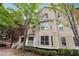 Tan three-story building with many windows and landscaping at 5641 Roswell Rd # 103, Atlanta, GA 30342