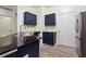 Kitchen with dark blue cabinets, granite counters, and stainless steel appliances at 5641 Roswell Rd # 103, Atlanta, GA 30342