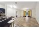 Open living room with hardwood floors and access to kitchen at 5641 Roswell Rd # 103, Atlanta, GA 30342