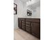 Dark vanity bathroom with double sinks at 6075 Marigold Way, Atlanta, GA 30349