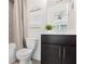 Clean bathroom with a tub and dark vanity at 6075 Marigold Way, Atlanta, GA 30349