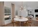 Bright dining area with round table and view to backyard at 6075 Marigold Way, Atlanta, GA 30349