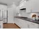 Modern kitchen with stainless steel appliances and white cabinetry at 6075 Marigold Way, Atlanta, GA 30349