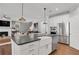 Open concept kitchen with island and farmhouse sink at 6075 Marigold Way, Atlanta, GA 30349