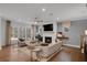 Spacious living area with fireplace, hardwood floors, and comfy sofas at 6075 Marigold Way, Atlanta, GA 30349