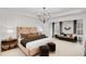 Large main bedroom with sitting area and chandelier at 6075 Marigold Way, Atlanta, GA 30349