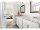 Bathroom with granite countertops, double vanity, and updated fixtures at 1618 Athens Sw Ave, Atlanta, GA 30310