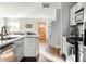 Open concept kitchen with granite island and hardwood floors at 1618 Athens Sw Ave, Atlanta, GA 30310