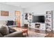 Spacious living area featuring a large TV and comfortable seating at 1618 Athens Sw Ave, Atlanta, GA 30310