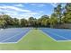 Well-maintained tennis courts with blue and green surface at 1618 Athens Sw Ave, Atlanta, GA 30310
