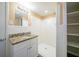 Clean bathroom, granite vanity, tiled shower, and shelving at 2725 Rainbow Forest Dr, Decatur, GA 30034