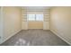 Bright bedroom with built-in shelving and neutral carpeting at 2725 Rainbow Forest Dr, Decatur, GA 30034