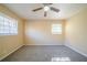 Spacious bedroom with ceiling fan and neutral carpeting at 2725 Rainbow Forest Dr, Decatur, GA 30034
