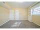 Spacious bedroom with double closets and neutral carpeting at 2725 Rainbow Forest Dr, Decatur, GA 30034