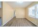 Simple dining room with wood-look floors and neutral walls at 2725 Rainbow Forest Dr, Decatur, GA 30034