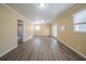 Spacious living room with wood-look floors and neutral walls at 2725 Rainbow Forest Dr, Decatur, GA 30034