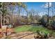 Large backyard with a pool, lawn, and basketball court at 60 Old Fuller Mill Ne Rd, Marietta, GA 30067