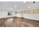 Finished basement with hardwood floors and built-in shelves at 60 Old Fuller Mill Ne Rd, Marietta, GA 30067