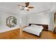 Main bedroom features hardwood floors, large mirror, and ensuite bathroom at 60 Old Fuller Mill Ne Rd, Marietta, GA 30067