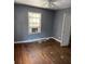Bedroom with hardwood floors and window at 678 Charlotte Nw Pl, Atlanta, GA 30318