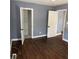 Hardwood floor bedroom with gray walls and closet at 678 Charlotte Nw Pl, Atlanta, GA 30318