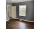 Simple bedroom with hardwood floors and gray walls at 678 Charlotte Nw Pl, Atlanta, GA 30318