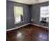 Empty bedroom featuring hardwood floors and gray walls at 678 Charlotte Nw Pl, Atlanta, GA 30318