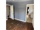Bedroom with hardwood floors and kitchen access at 678 Charlotte Nw Pl, Atlanta, GA 30318