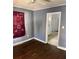 Dining room with hardwood floors and kitchen access at 678 Charlotte Nw Pl, Atlanta, GA 30318